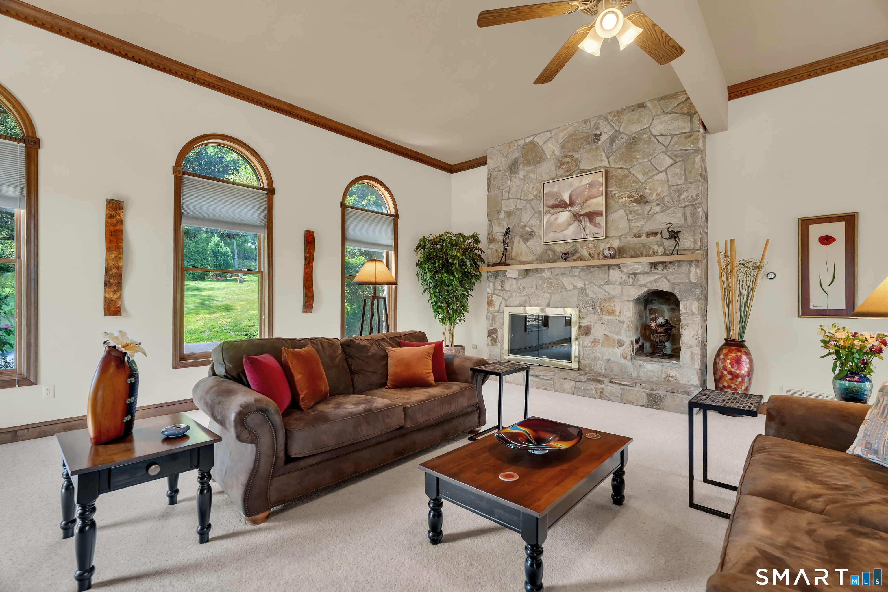 194 Quaker Farms Road Oxford, CT 06478 - Photo 12 of 40 a living room with furniture fireplace and a large window