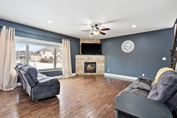 a living room with furniture and a fireplace