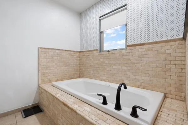 a view of a storage and utility room with a sink