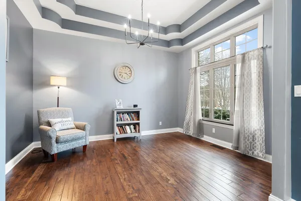 a living room with furniture and a table