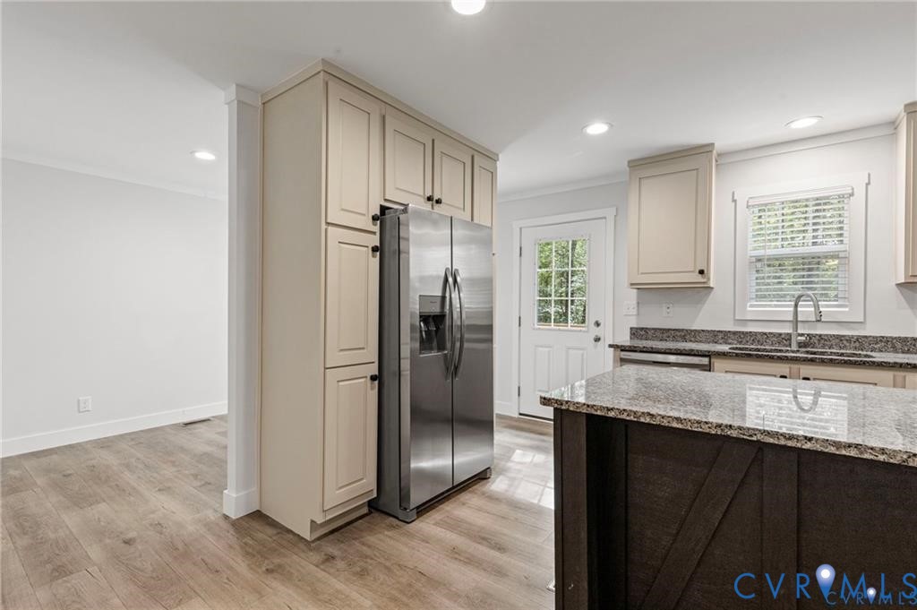 6584 Blenheim Road Powhatan, VA 23139 - Photo 10 of 31 Kitchen with cream cabinets, dark stone countertop