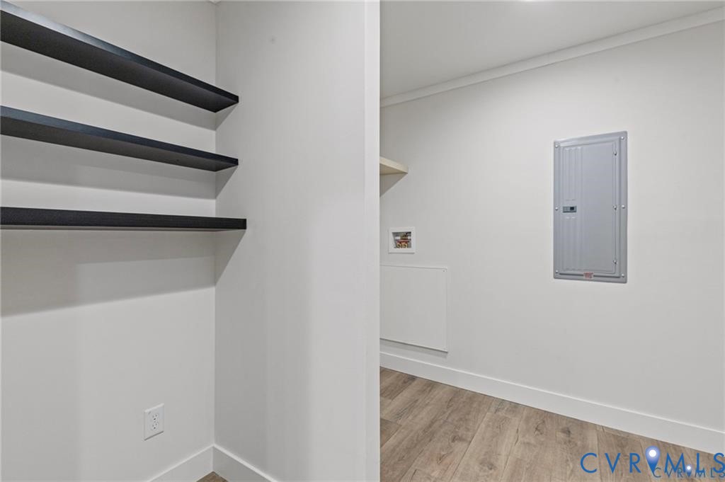 6584 Blenheim Road Powhatan, VA 23139 - Photo 12 of 31 Laundry area featuring electric panel, ornamental