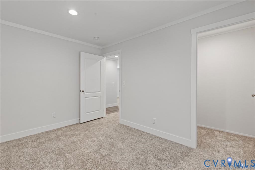 6584 Blenheim Road Powhatan, VA 23139 - Photo 17 of 31 Unfurnished bedroom with ornamental molding, light