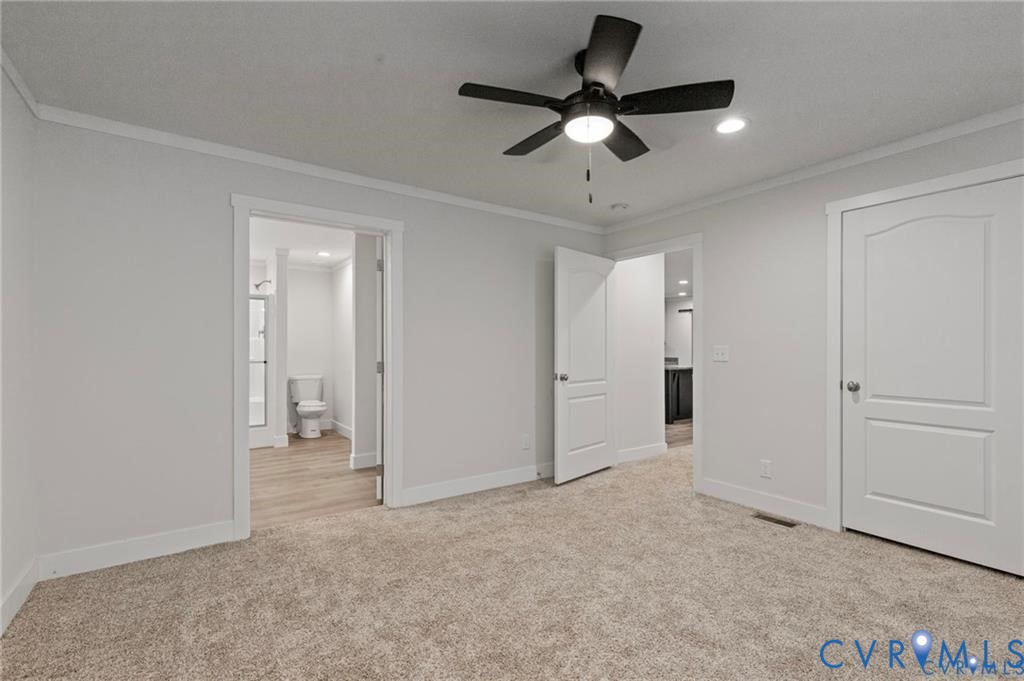 6584 Blenheim Road Powhatan, VA 23139 - Photo 22 of 31 Unfurnished bedroom with crown molding, light colo
