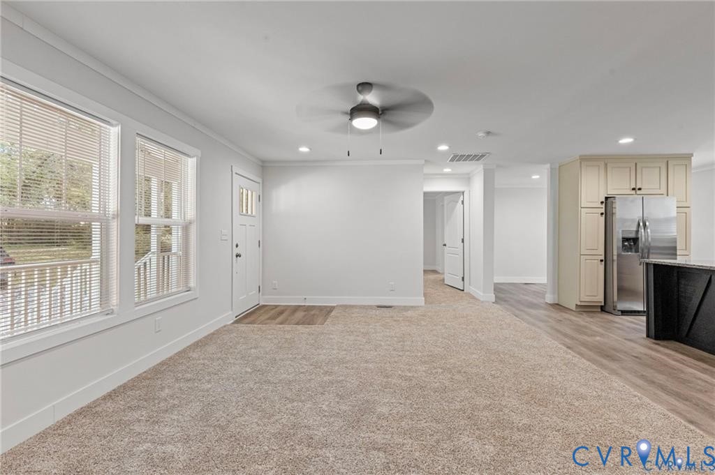 6584 Blenheim Road Powhatan, VA 23139 - Photo 7 of 31 Unfurnished living room with ceiling fan, ornament