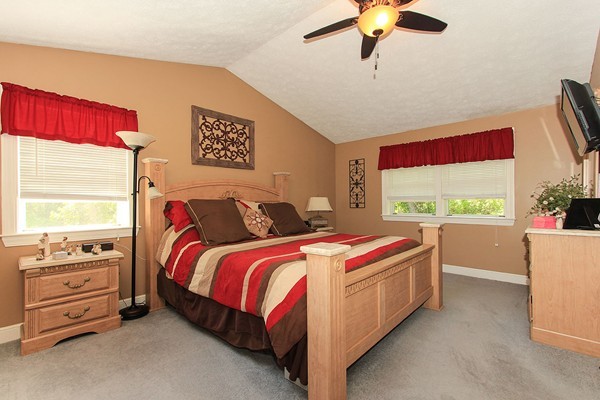 230 Winding Pond Road, Unit 230 Londonderry, NH 03053 - Photo 12 of 30 a bedroom with a bed and a window