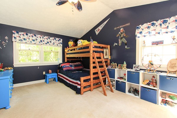 230 Winding Pond Road, Unit 230 Londonderry, NH 03053 - Photo 13 of 30 a bedroom with furniture and window