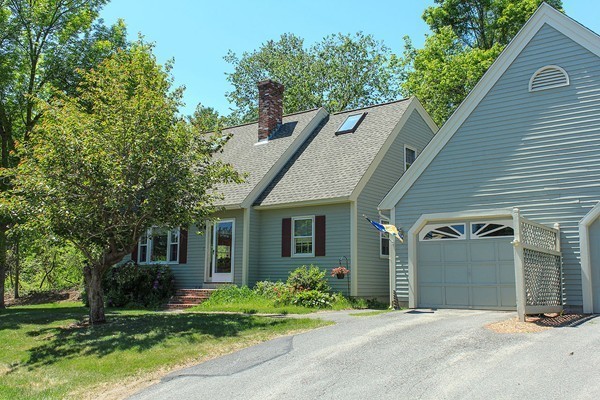 230 Winding Pond Road, Unit 230 Londonderry, NH 03053 - Photo 2 of 30 a view of a house with a yard and potted plants