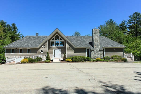 230 Winding Pond Road, Unit 230 Londonderry, NH 03053 - Photo 26 of 30 front view of a house with a yard