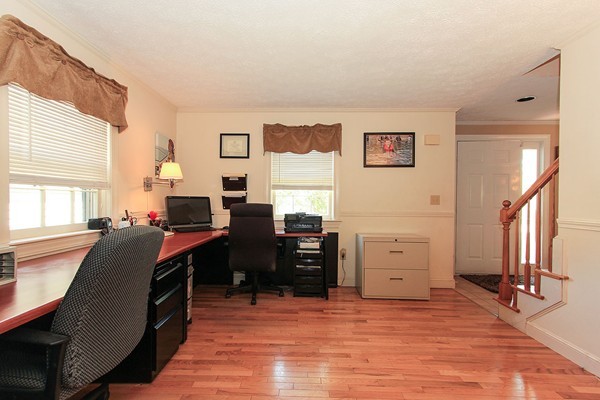 230 Winding Pond Road, Unit 230 Londonderry, NH 03053 - Photo 8 of 30 a room with furniture a piano and a window