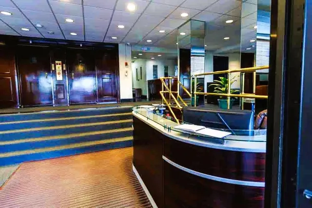 a view of a cafe with a potted plants