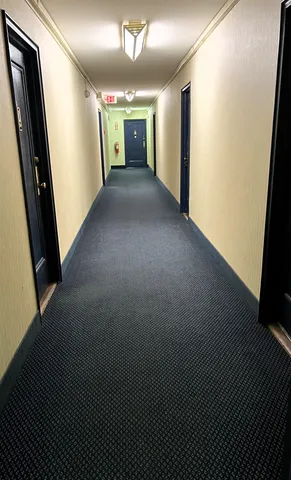 a view of a hallway with stairs