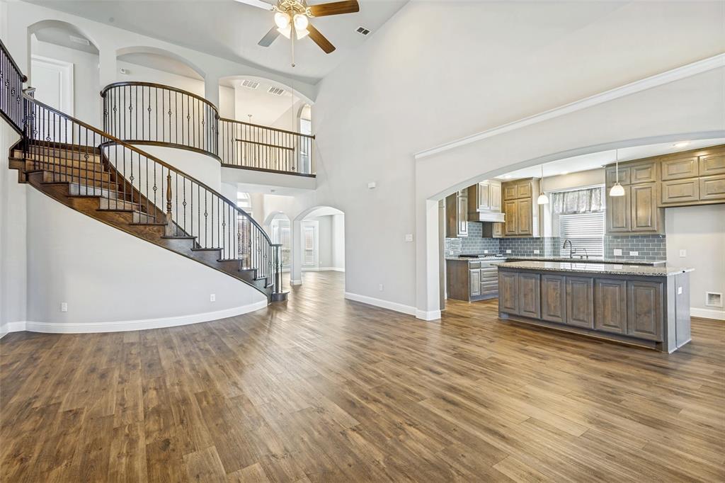 212 Wandering Way Anna, TX 75409 - Photo 13 of 36 a view of kitchen with cabinets and wooden floor
