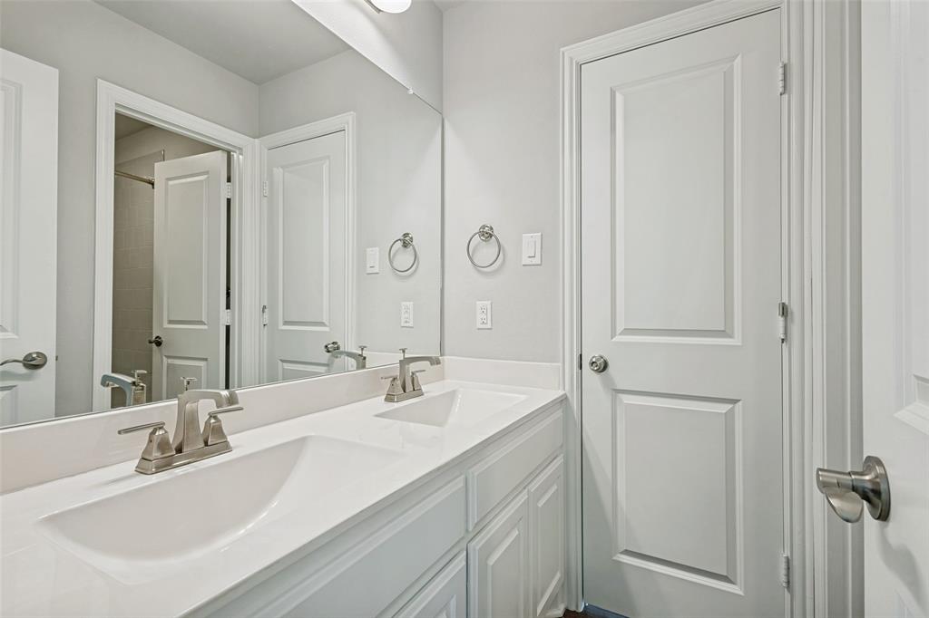 212 Wandering Way Anna, TX 75409 - Photo 21 of 36 a bathroom with double vanity sink and a mirror