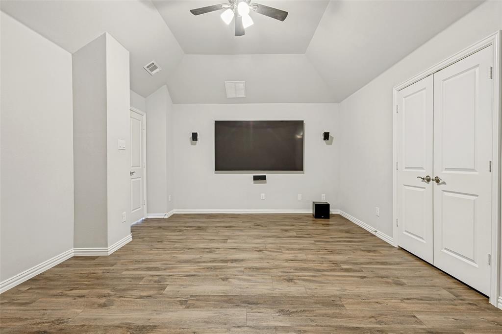 212 Wandering Way Anna, TX 75409 - Photo 23 of 36 a view of an empty room with a flat screen tv