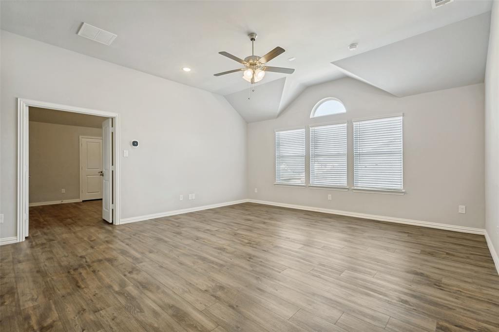 212 Wandering Way Anna, TX 75409 - Photo 24 of 36 wooden floor in an empty room with a window