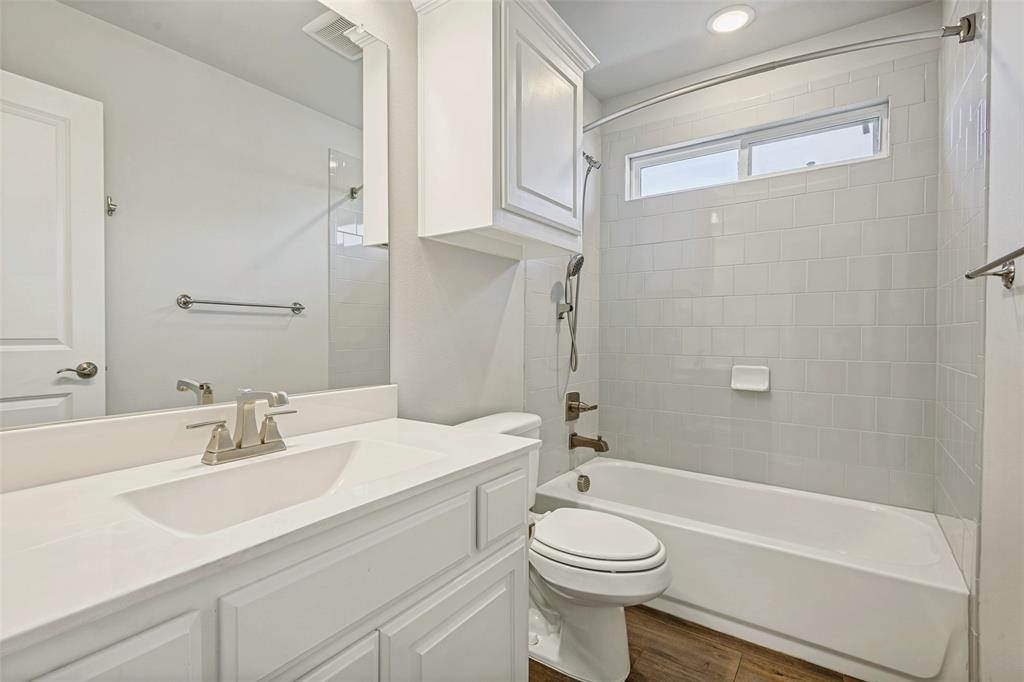 212 Wandering Way Anna, TX 75409 - Photo 26 of 36 a bathroom with a sink a toilet and a bathtub