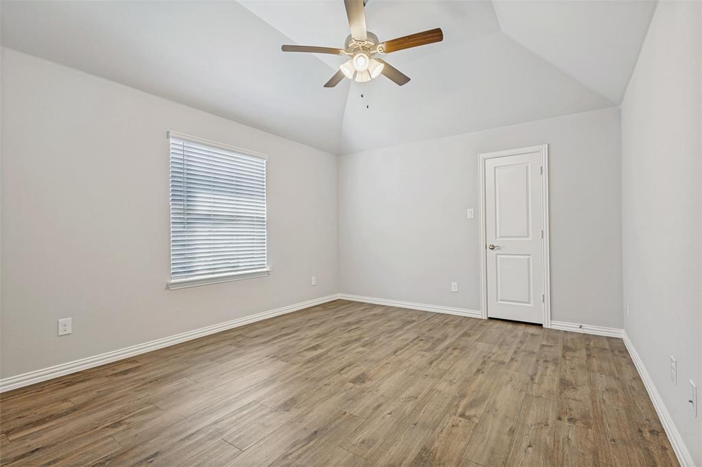 212 Wandering Way Anna, TX 75409 - Photo 27 of 36 wooden floor in an empty room with a window
