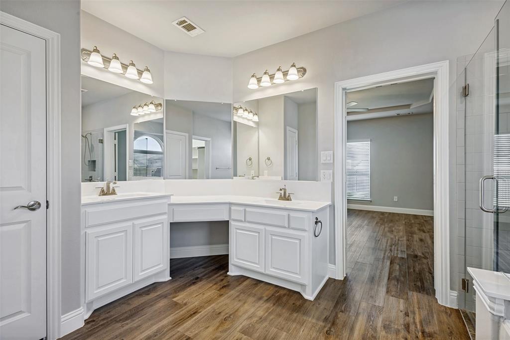 212 Wandering Way Anna, TX 75409 - Photo 31 of 36 a spacious bathroom with a double vanity sink and a mirror