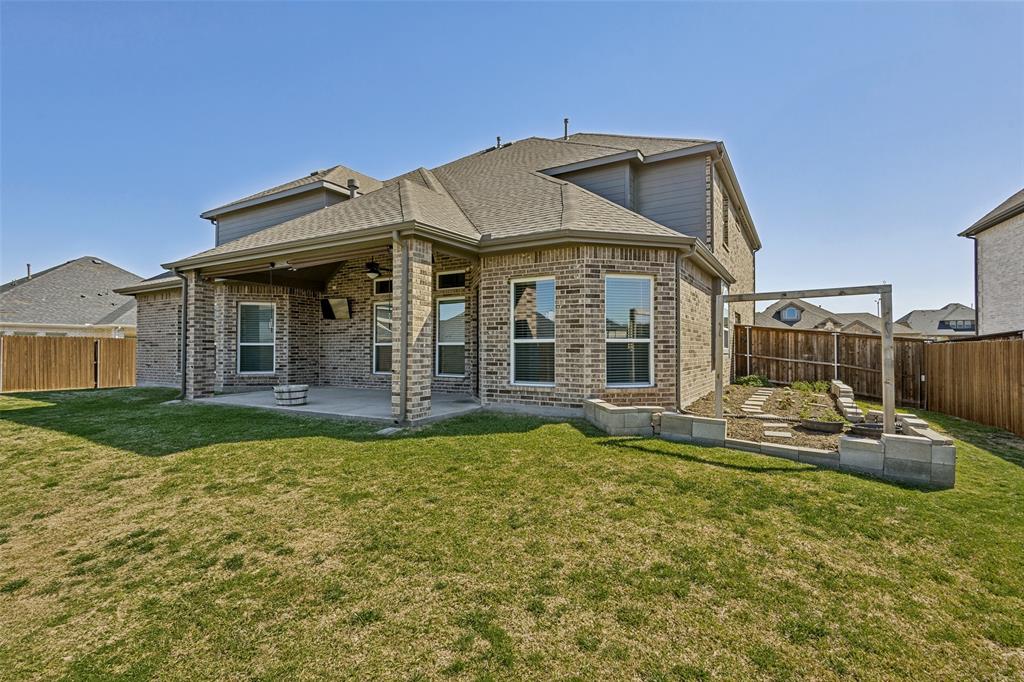 212 Wandering Way Anna, TX 75409 - Photo 33 of 36 a front view of a house with garden