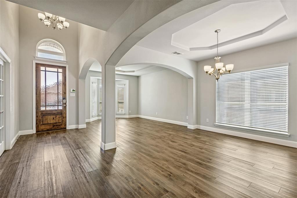 212 Wandering Way Anna, TX 75409 - Photo 6 of 36 a view of livingroom with hardwood floor and window