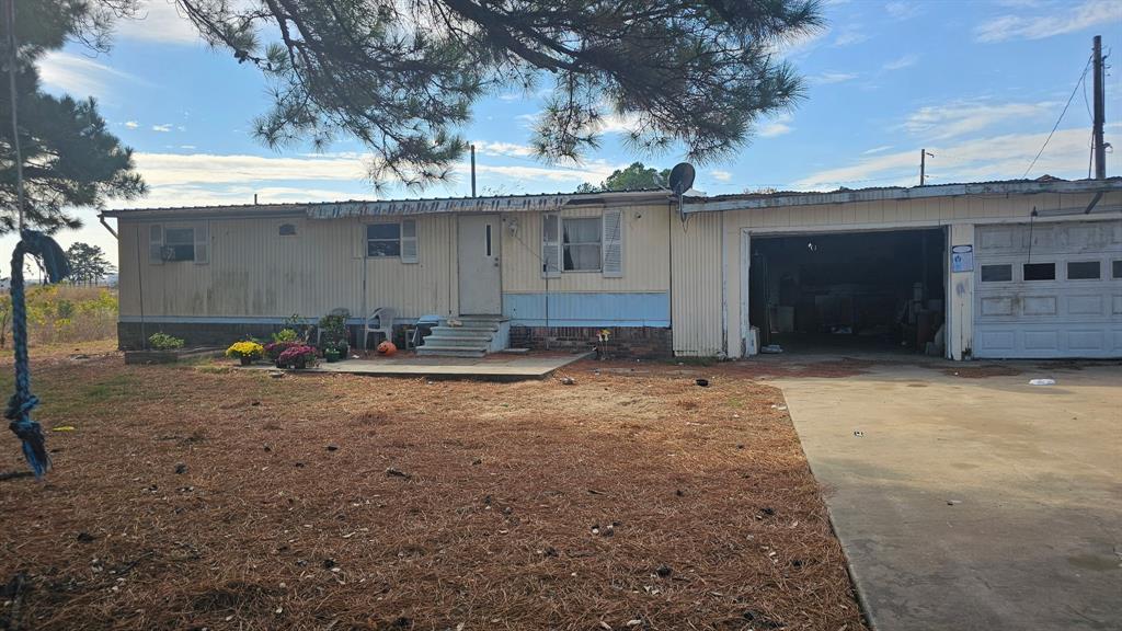 a view of a backyard of the house