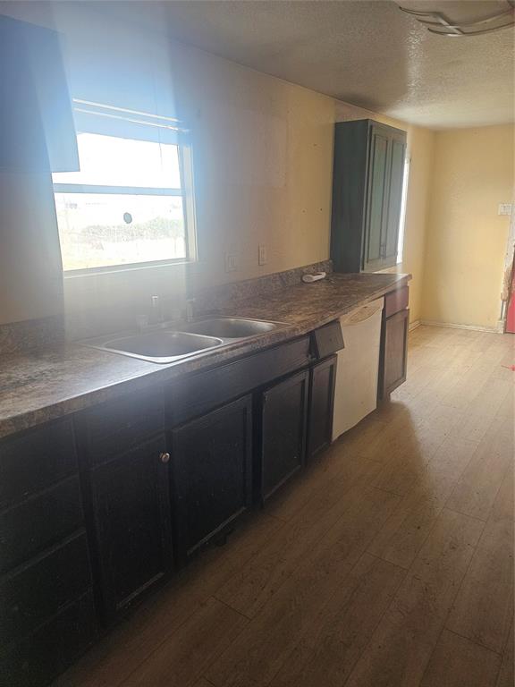 59 Private Road Brookston, TX 75421 - Photo 2 of 6 a bathroom with a granite countertop sink and a window
