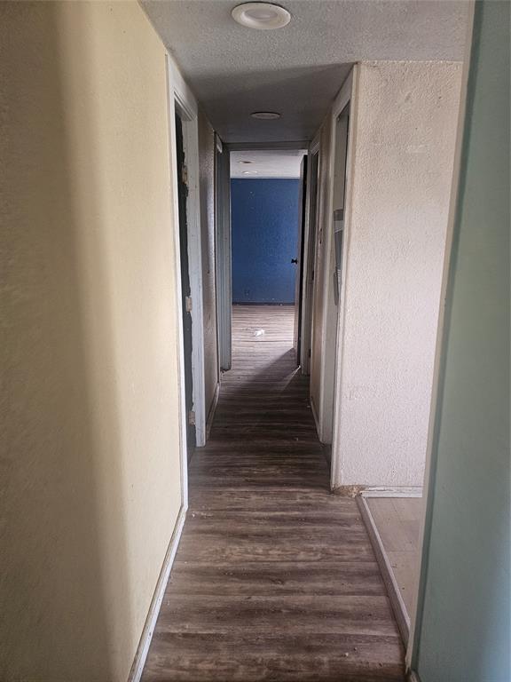 59 Private Road Brookston, TX 75421 - Photo 6 of 6 a view of a hallway with wooden floor and stairs