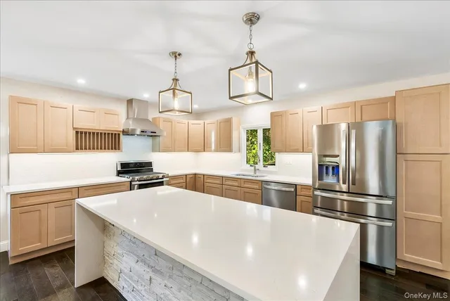 a kitchen with a sink and refrigerator