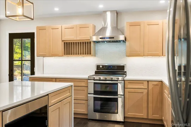 an empty room with wooden floor and a window