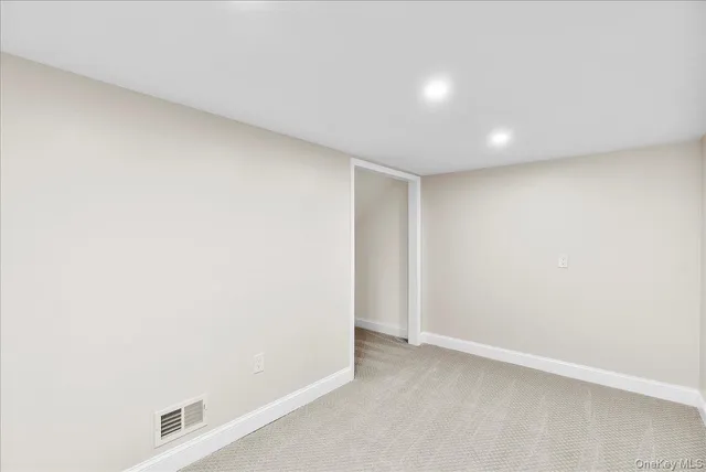 a bathroom with a shower sink and mirror