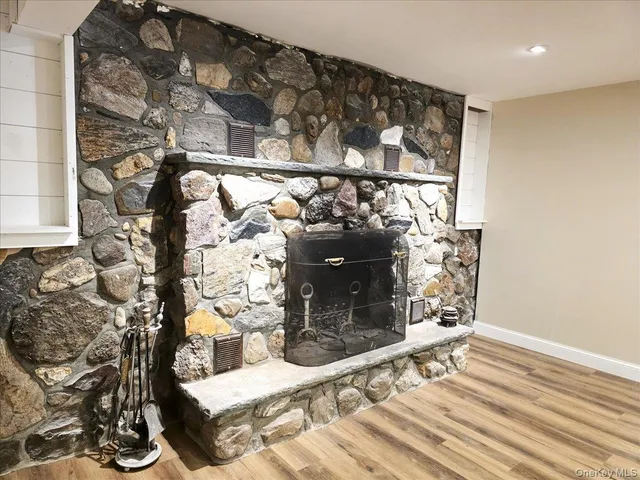 a bathroom with a toilet sink a shower and vanity