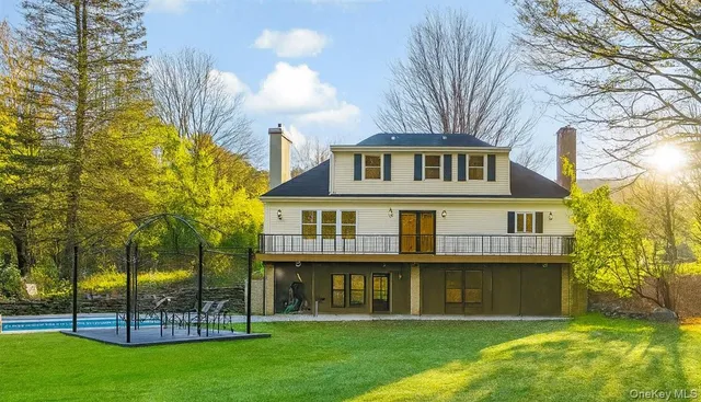 a living room with a fireplace and a flat screen tv