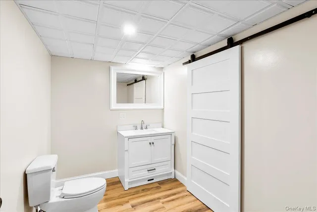 a view of small space with wooden floor and windows