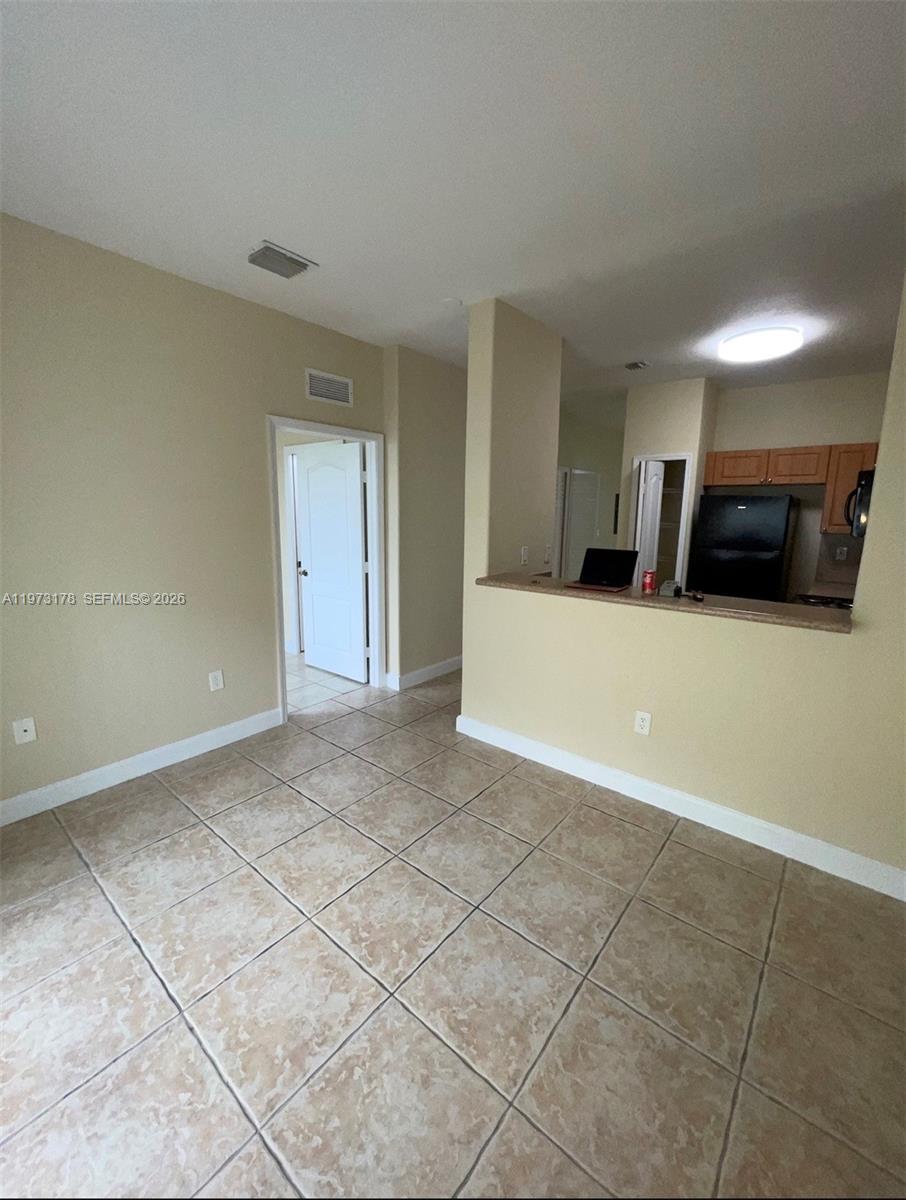 1661 Southeast 29th Court, Unit 109 Homestead, FL 33035 - Photo 1 of 18 a view of a livingroom with furniture