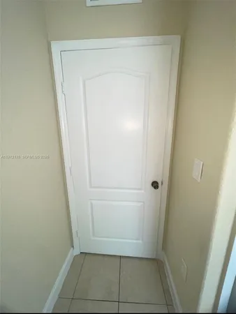 an empty room with a bathroom