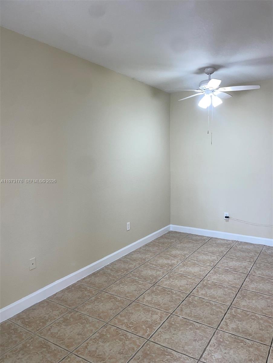 1661 Southeast 29th Court, Unit 109 Homestead, FL 33035 - Photo 16 of 18 a view of an empty room