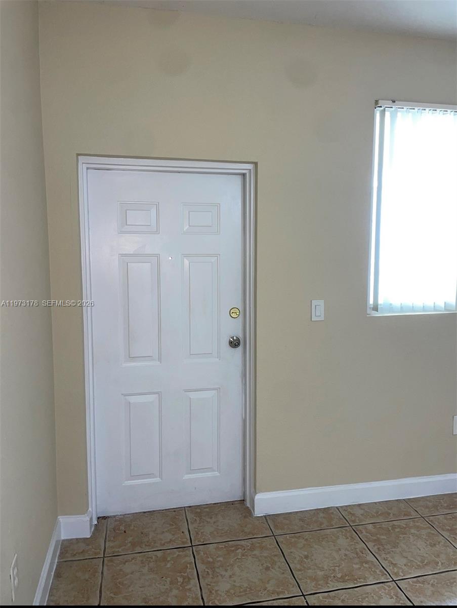 1661 Southeast 29th Court, Unit 109 Homestead, FL 33035 - Photo 18 of 18 a view of room with window