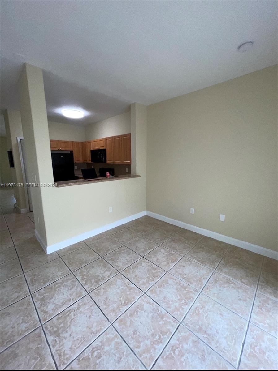 1661 Southeast 29th Court, Unit 109 Homestead, FL 33035 - Photo 2 of 18 a view of a room with a sink