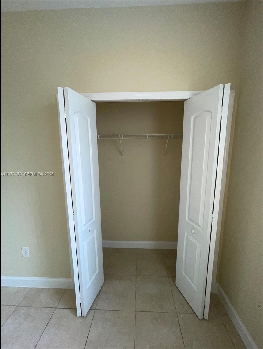 1661 Southeast 29th Court, Unit 109 Homestead, FL 33035 - Photo 5 of 18 a view of room with front door