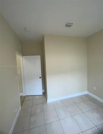 a bathroom with a sink and a washer dryer