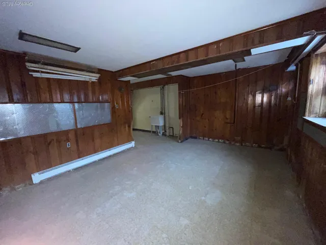 a view of a room with wooden walls