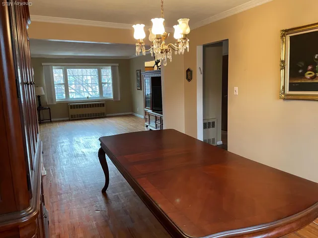 a room with pool table and windows