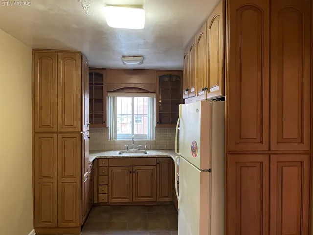 a bathroom with a sink a mirror and shower