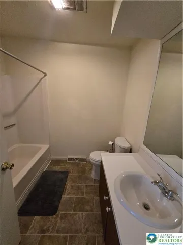 a bathroom with a sink and a bathtub