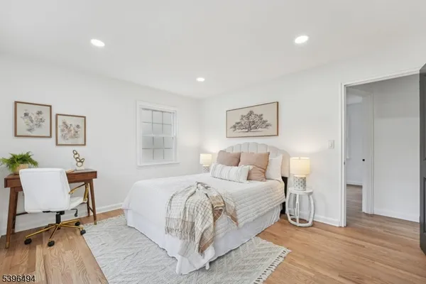 a bedroom with a bed and a table