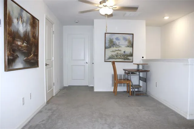 a view of room with furniture and a chandelier