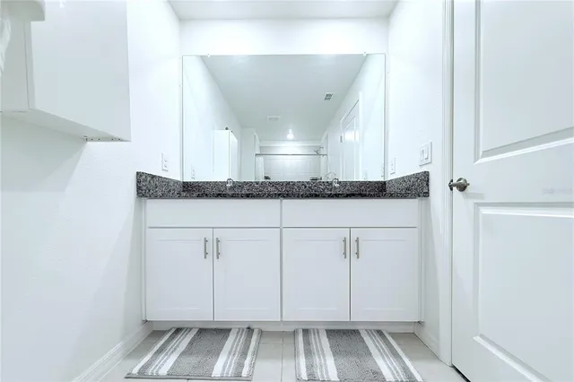 a view of a kitchen counter space and cabinets