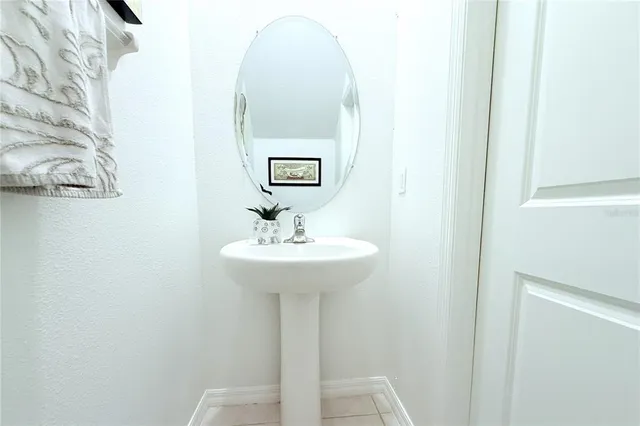 a bathroom with a sink and mirror