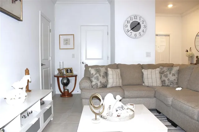 a living room with furniture and a table